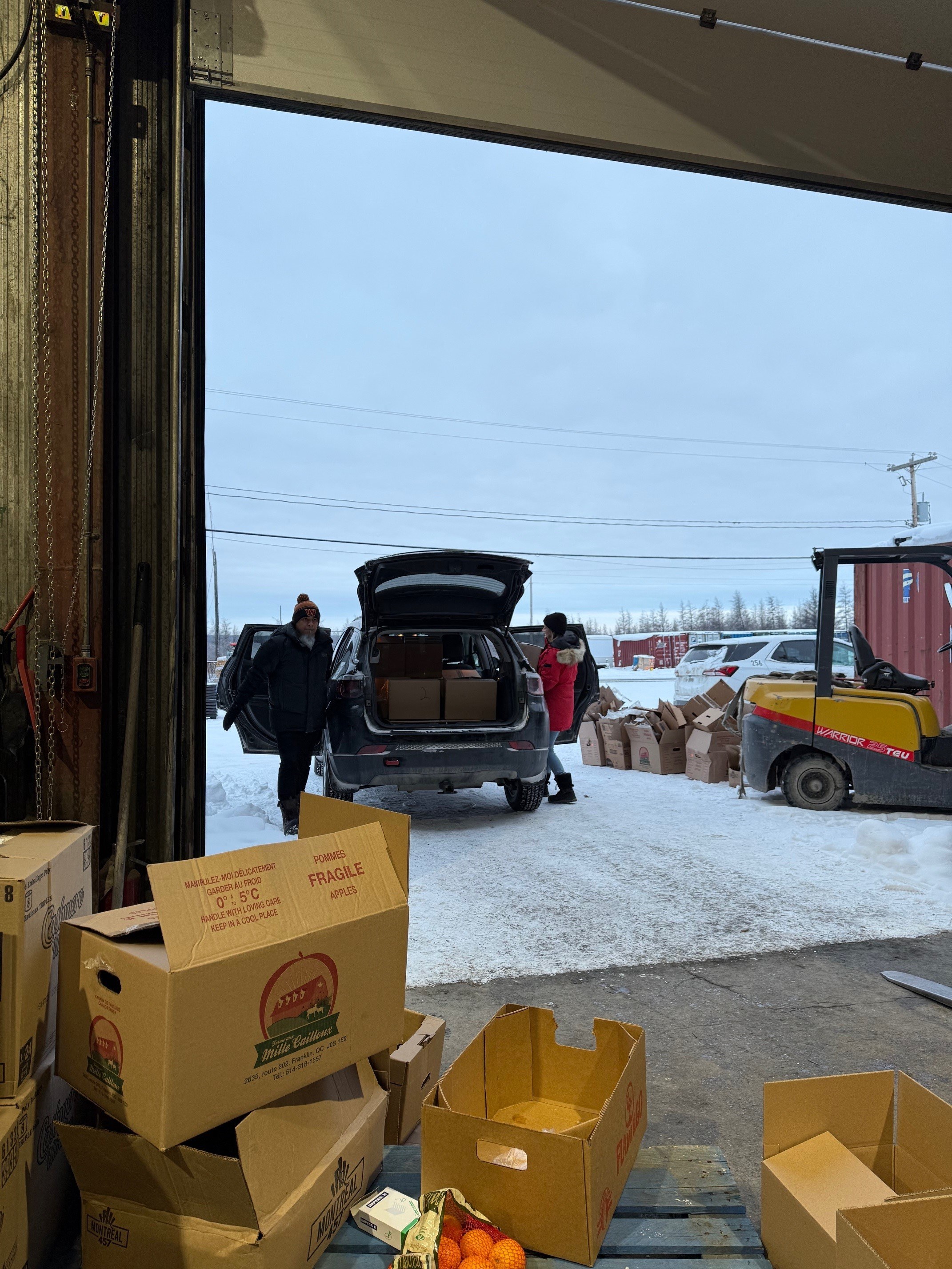 Filling up the car John Quinteros and Marie eve lacroix Kuujjuaq