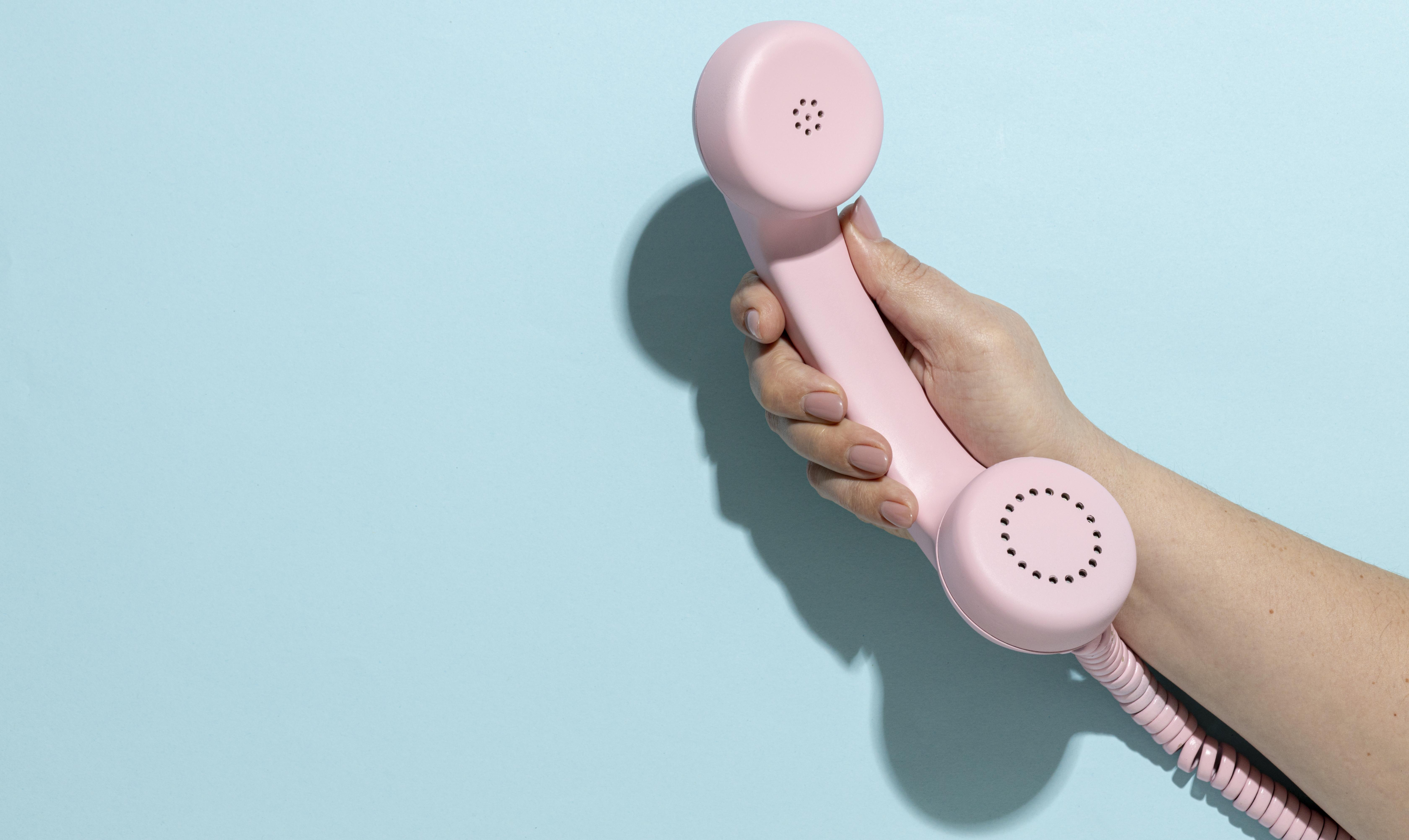 Vintage pink telephone composition 1